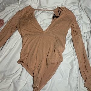 Tan bodysuit, with open back and low cut front